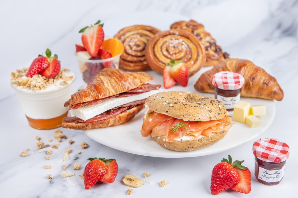 Posh Nosh continental breakfast buffet featuring pastries, filled bagels, croissants, yoghurt and fresh fruit.